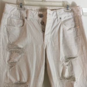 Distressed white jeans